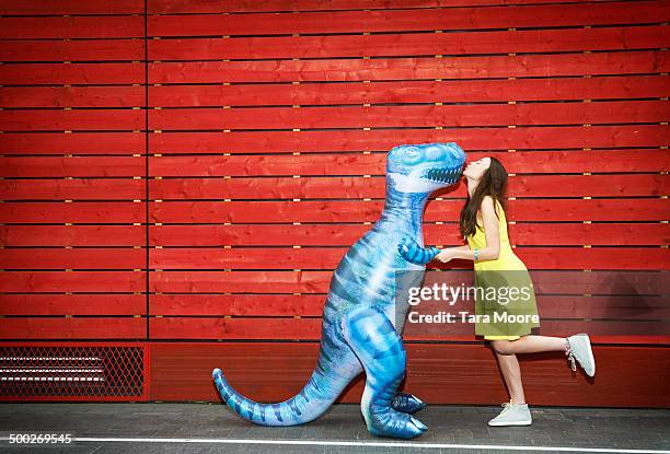 woman kissing toy dinosaur - dinosaur toy i - fotografias e filmes do acervo