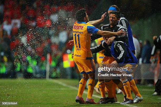 Damian Alvarez of Tigres celebrate with teammates after scoring the second goal of his team during the semifinals second leg match between Toluca and...