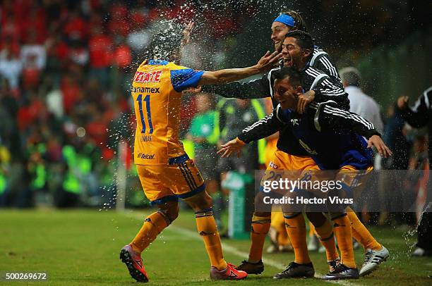 Damian Alvarez of Tigres celebrate with teammates after scoring the second goal of his team during the semifinals second leg match between Toluca and...