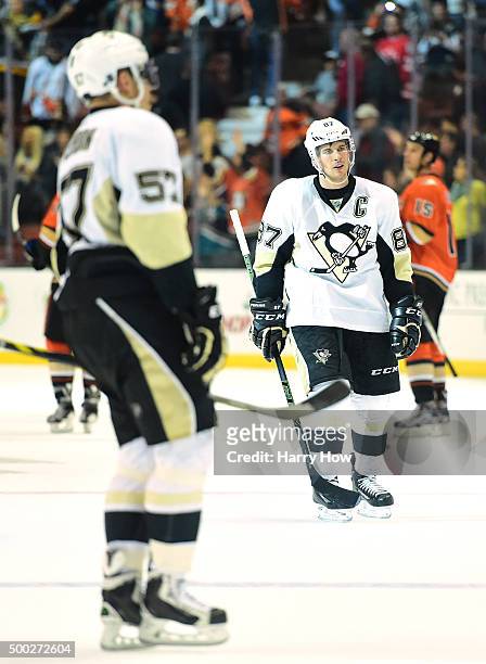 Sidney Crosby of the Pittsburgh Penguins and David Perron leave the ice after a 2-1 loss to the Anaheim Ducks at Honda Center on December 6, 2015 in...