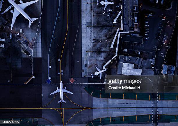 airliners at gates and control tower at lax - airport aerial imagens e fotografias de stock