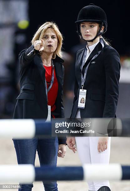 Virginie Couperie-Eiffel gives her instructions to Mathilde Pinault, daughter of Francois-Henri Pinault during day three of the Longines Paris...