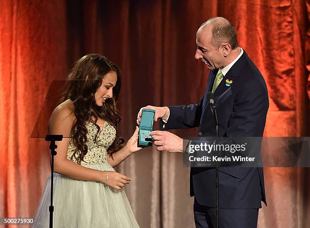 Honoree Jazz Jennings accepts an award from chairman of Walt Disney International Andy Bird onstage during TrevorLIVE LA 2015 at Hollywood Palladium...