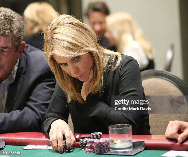 Actress Cheryl Hines reacts while playing poker at the '2015 CBS Deer Valley Celebrity Skifest' on December 6, 2015 in Park City, Utah.