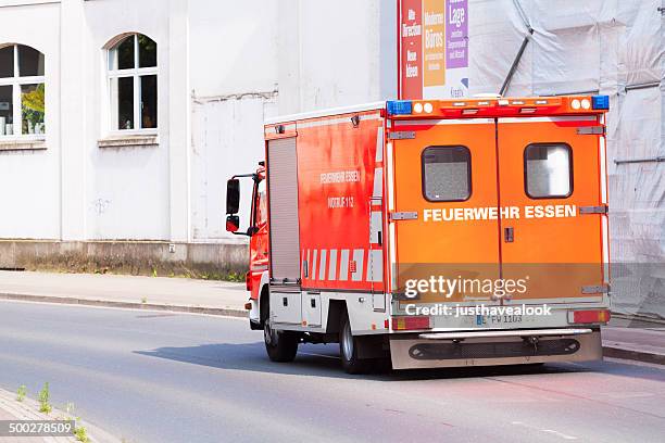 rettungswagen of fire engine - feuerwehr deutschland stock-fotos und bilder