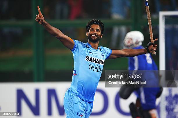 Rupinder Pal Singh of India celebrates after he scores to win the penalty shoot out for third place during the match between Netherlands and India on...