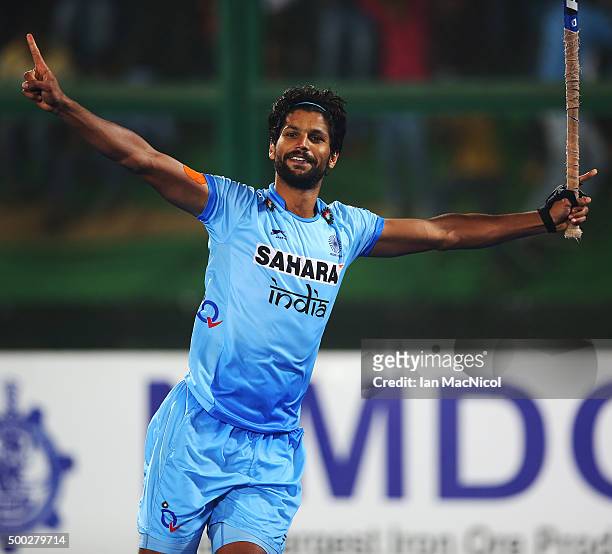 Rupinder Pal Singh of India celebrates scoring the winning penalty during the penalty shoot out during the match between Netherlands and India on day...