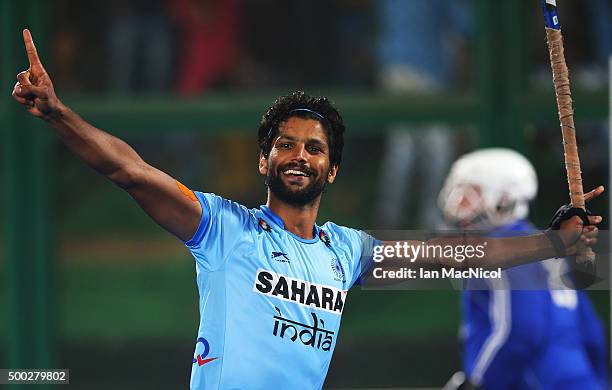 Rupinder Pal Singh of India celebrates after he scores to win the penalty shoot out for third place during the match between Netherlands and India on...