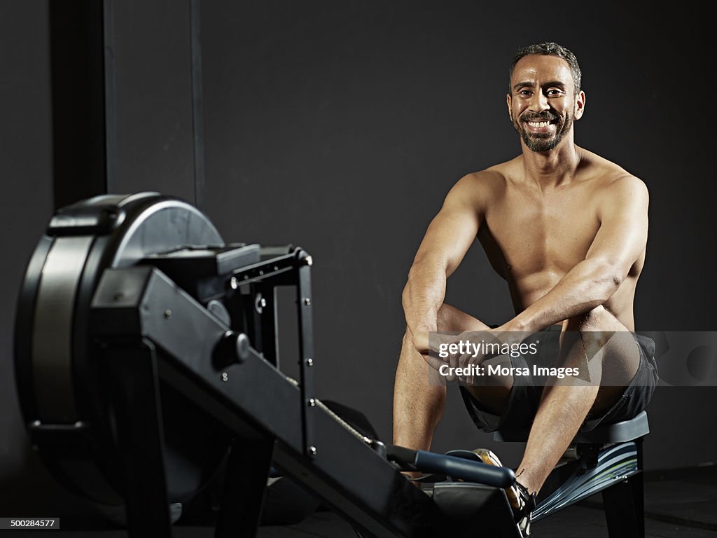 Portrait of gym at rowing machine