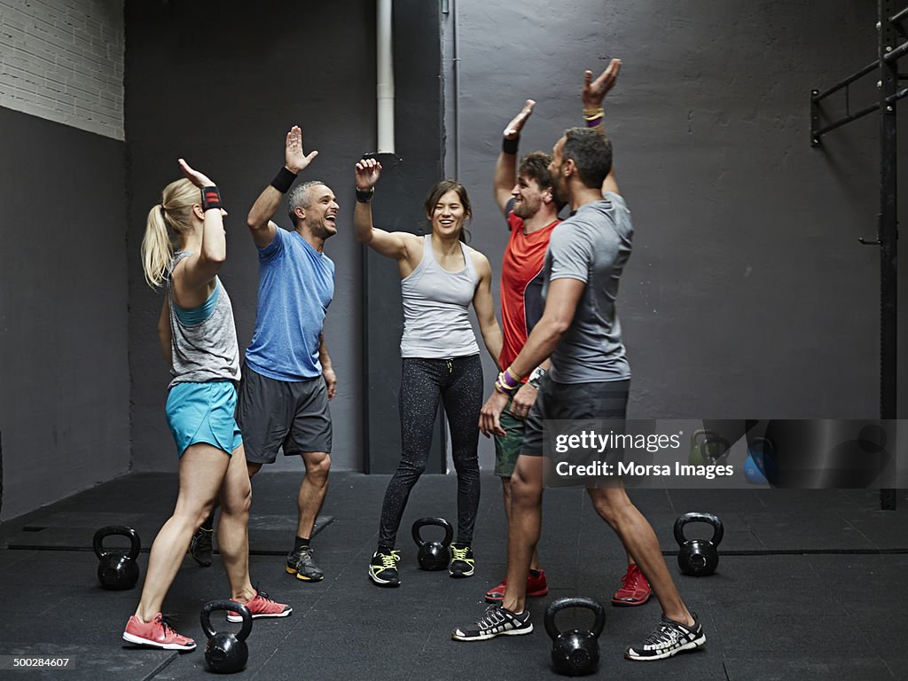 Group of gymters celebrating workout