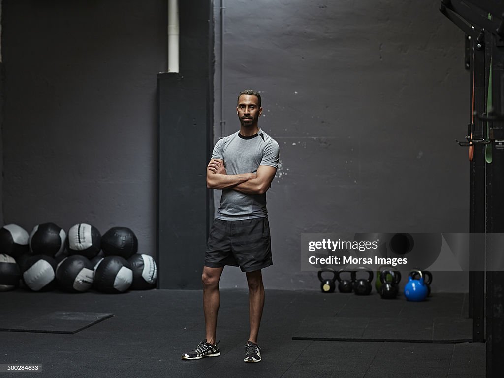 Portrait of male athlete in gym gym