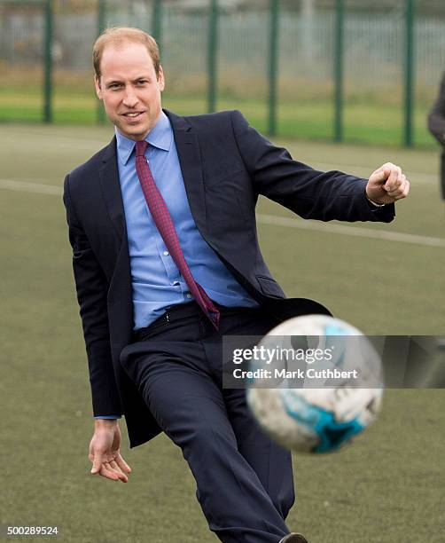 Prince William, Duke of Cambridge takes a penalty kick during a visit to The Football for Peace initiative at Saltley Academy on December 7, 2015 in...