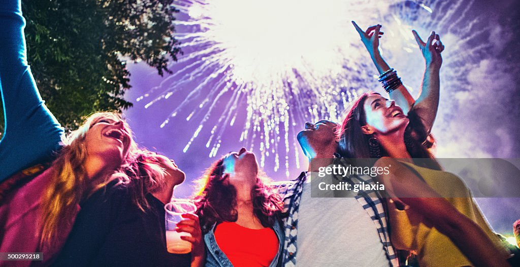People celebrating with fireworks.