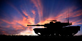 Modern heavy tank at sunset
