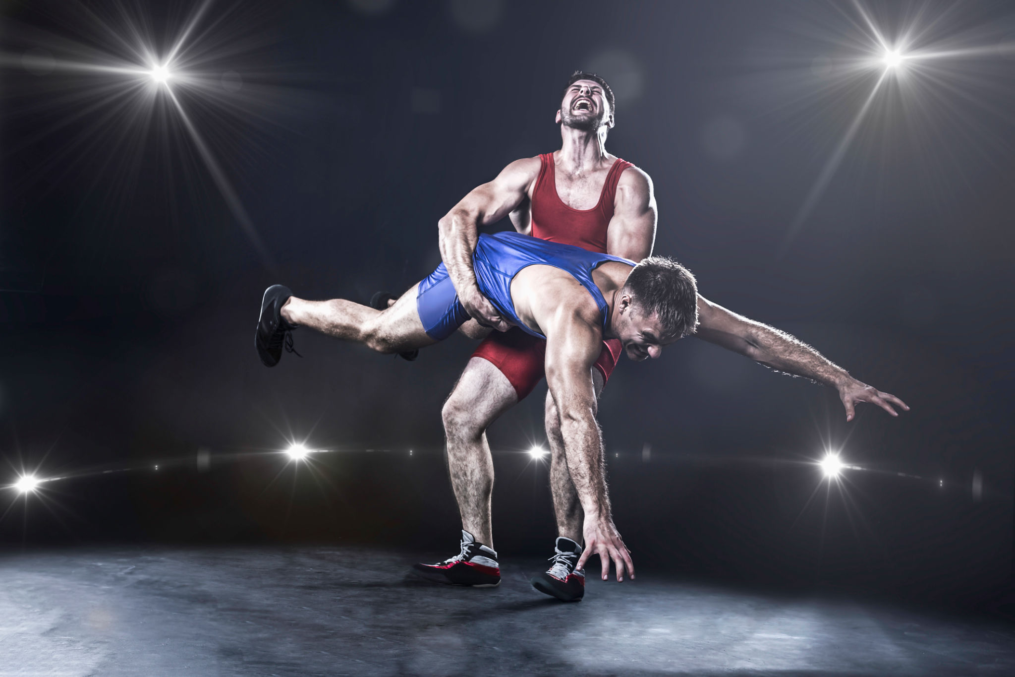 Freestyle wrestler throwing Freestyle wrestler throwing
