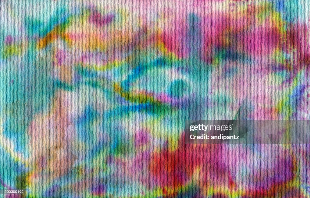 Bright rainbow colors with tie dyed texture background