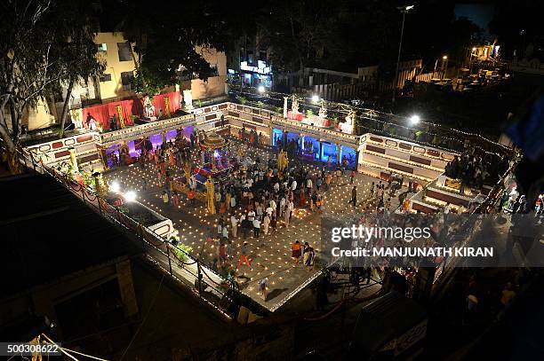 Hindu devotees light oil lamps at a temple for the Hindu God Shiva during the celebration of the Tamil Hindu festival of "Karthigai Deepam" in...