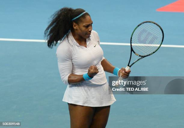 Tennis player Serena Williams of Philippine Mavericks celebrates a point against Croatias Mirjana Lucic-Baroni of Japan Warriors in the women's...