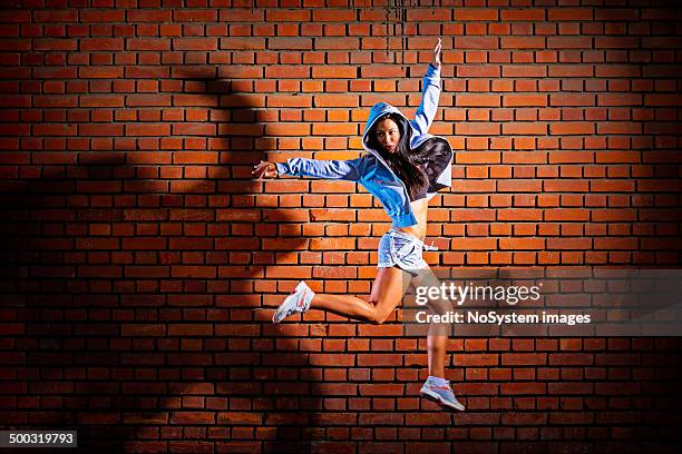 jump - freestyle dance stock pictures, royalty-free photos & images