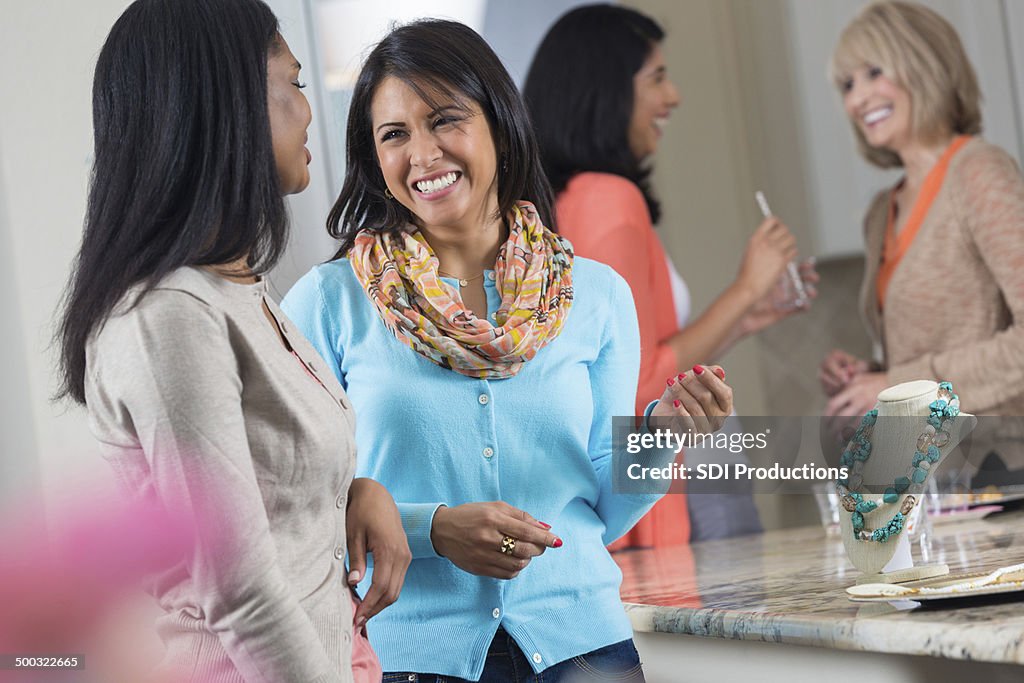 Women shopping for jewelry together at direct sales party