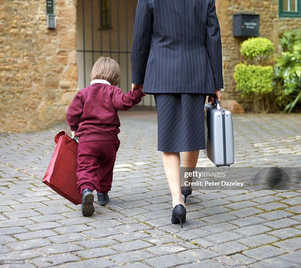 Single working mother taking child to school