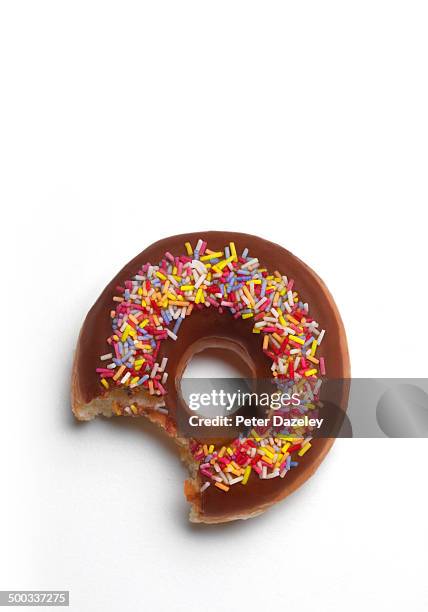 bite out of donut with copy space - bite mark stock pictures, royalty-free photos & images