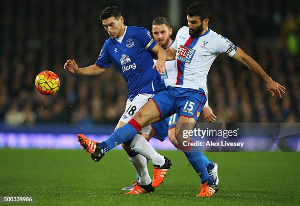 Gareth Barry of Everton challenges Mile Jedinak of Crystal Palace during the Barclays Premier League match between Everton and Crystal Palace at...