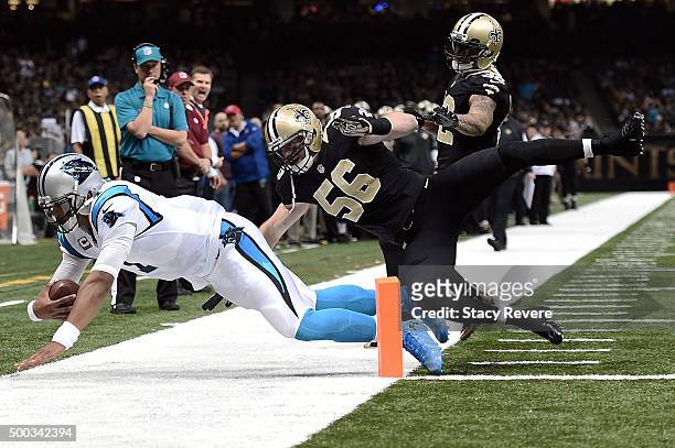 Cam Newton of the Carolina Panthers is hit by Michael Mauti of the New Orleans Saints during a game at the Mercedes-Benz Superdome on December 6,...