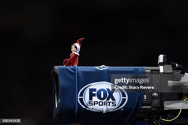 Detailed view of an elf sitting on a Fox Sports camera during a game between the New Orleans Saints and the Carolina Panthers at the Mercedes-Benz...