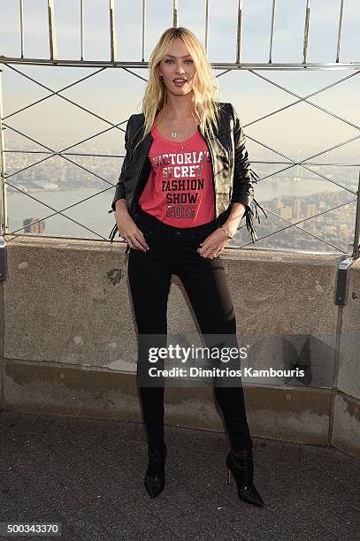 Victoria's Secret Angel Candice Swanepoel Lights The Empire State Building In Pink Stripes on December 7, 2015 in New York City.