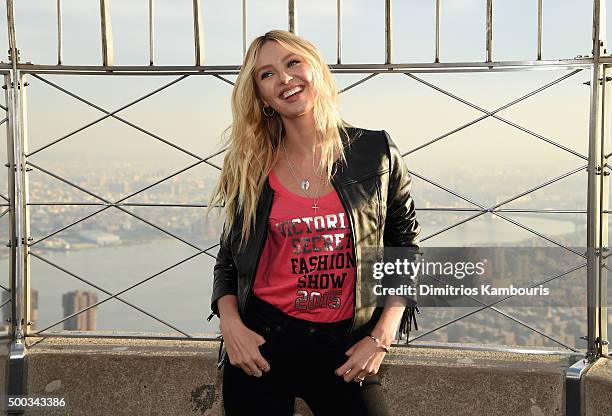 Victoria's Secret Angel Candice Swanepoel Lights The Empire State Building In Pink Stripes on December 7, 2015 in New York City.