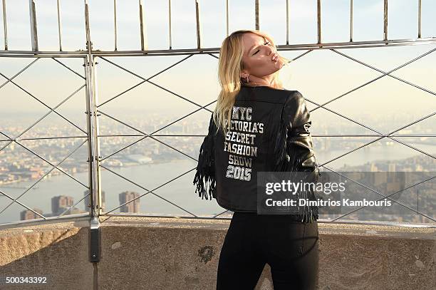 Victoria's Secret Angel Candice Swanepoel Lights The Empire State Building In Pink Stripes on December 7, 2015 in New York City.