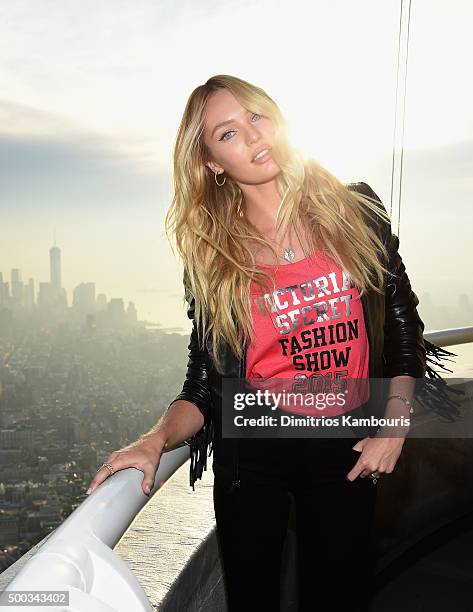 Victoria's Secret Angel Candice Swanepoel Lights The Empire State Building In Pink Stripes on December 7, 2015 in New York City.