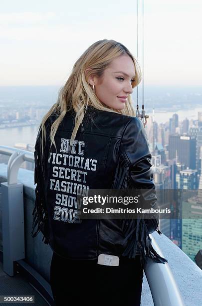 Victoria's Secret Angel Candice Swanepoel Lights The Empire State Building In Pink Stripes on December 7, 2015 in New York City.