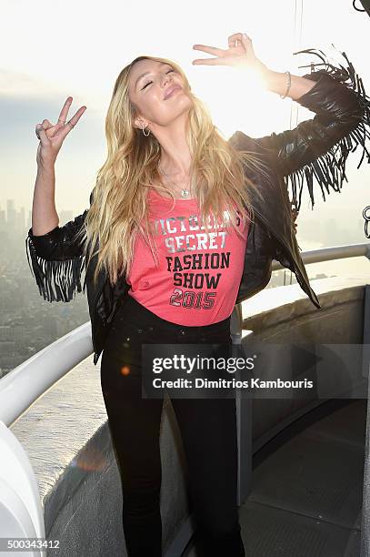 Victoria's Secret Angel Candice Swanepoel Lights The Empire State Building In Pink Stripes on December 7, 2015 in New York City.