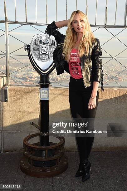 Victoria's Secret Angel Candice Swanepoel Lights The Empire State Building In Pink Stripes on December 7, 2015 in New York City.