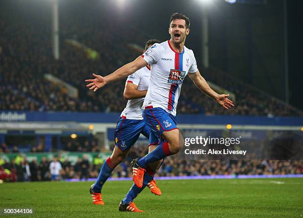 Scott Dann of Crystal Palace celebrates scoring the opening goal during the Barclays Premier League match between Everton and Crystal Palace at...