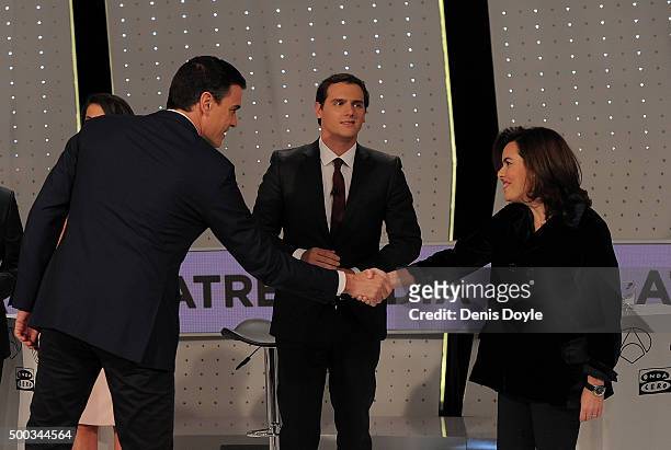 Pedro Sanchez, leader of the PSOE Socialist party shakes hands with Vice-President Soraya Saenz de Santamaria of the ruling Popular Party while...