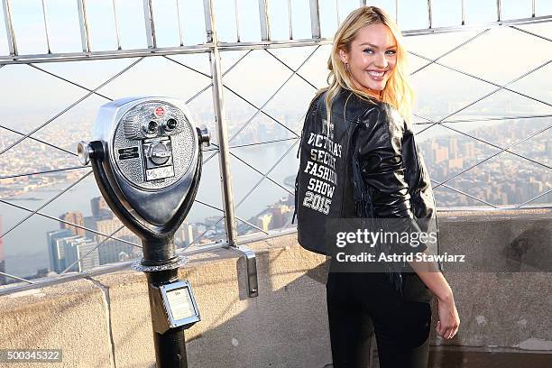 Victoria's Secret Angel Candice Swanepoel lights The Empire State Building In Pink Stripes on December 7, 2015 in New York City.