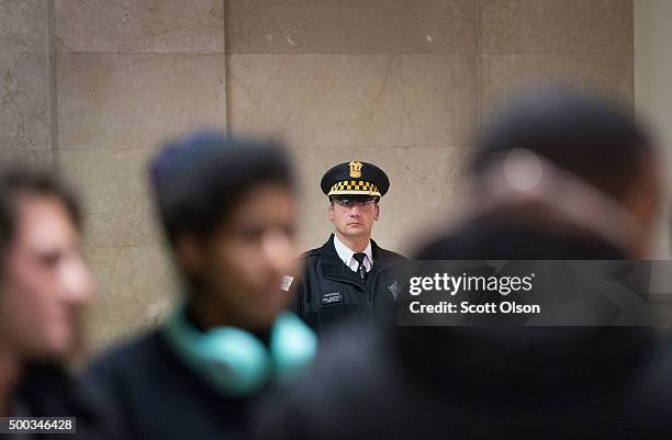 Demonstrators protest the shooting death of Laquan McDonald by a Chicago police officer outside the mayor's office in City Hall on December 7, 2015...