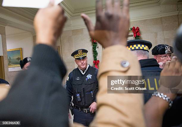 Demonstrators protest the shooting death of Laquan McDonald by a Chicago police officer outside the mayor's office in City Hall on December 7, 2015...