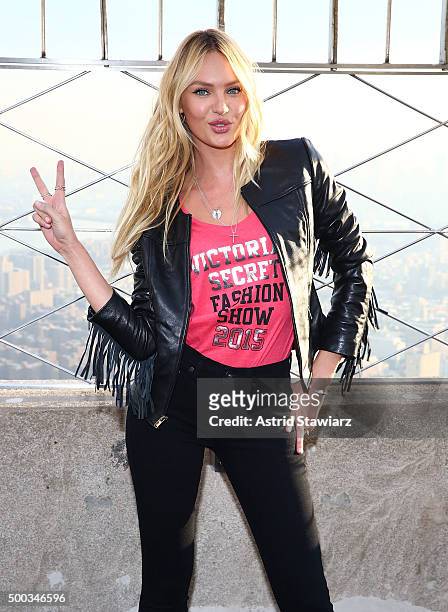 Victoria's Secret Angel Candice Swanepoel lights The Empire State Building In Pink Stripes on December 7, 2015 in New York City.