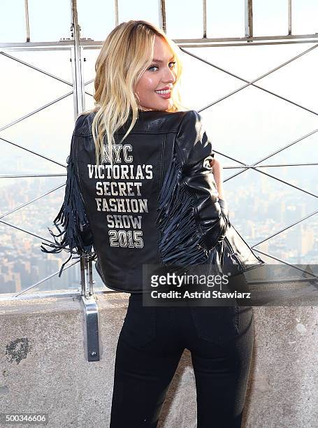 Victoria's Secret Angel Candice Swanepoel lights The Empire State Building In Pink Stripes on December 7, 2015 in New York City.