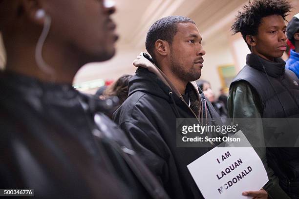 Demonstrators protest the shooting death of Laquan McDonald by a Chicago police officer outside the mayor's office in City Hall on December7, 2015 in...