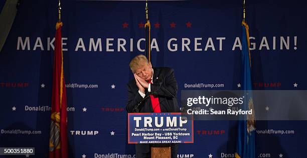 Republican presidential candidate Donald Trump references fellow candidate Jeb Bush at a Pearl Harbor Day Rally at the U.S.S. Yorktown December 7 in...