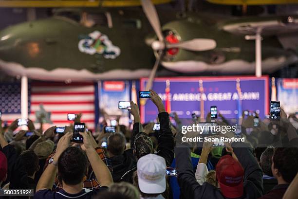 Supporters take photos as Republican presidential candidate Donald Trump speaks to the crowd Pearl Harbor Day Rally At USS Yorktown Monday, December...