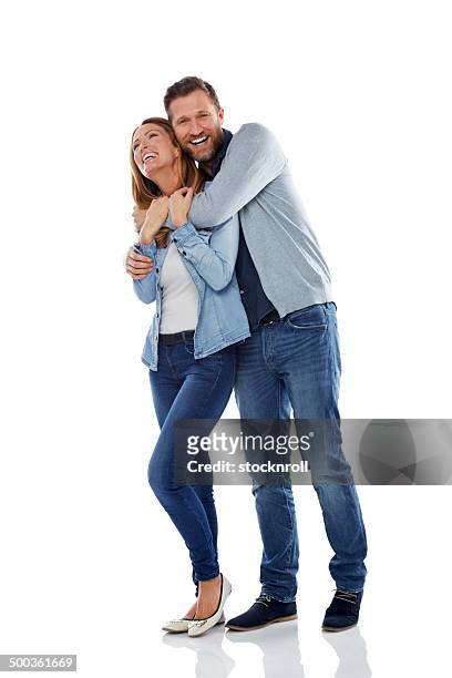 mature couple having fun on white background - couple laughing hugging bildbanksfoton och bilder