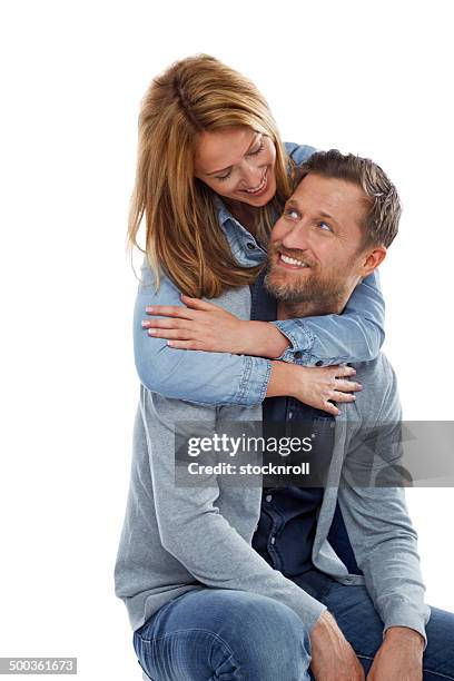 pretty woman embracing her boyfriend - funky middle age couple stockfoto's en -beelden