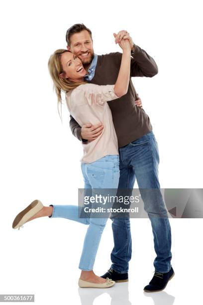cheerful couple dancing over white - couple full length stock pictures, royalty-free photos & images
