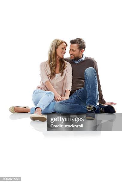 romantic mature couple sitting over white - funky middle age couple stockfoto's en -beelden